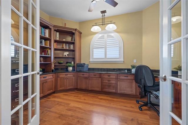 office featuring ceiling fan, light hardwood / wood-style floors, and french doors