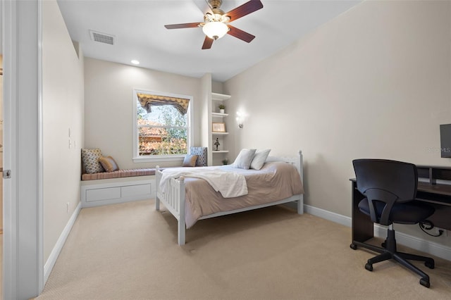 bedroom featuring light colored carpet and ceiling fan