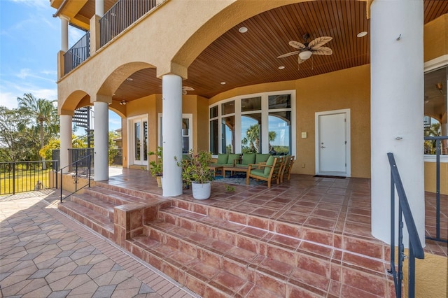 view of patio / terrace featuring an outdoor living space, a balcony, and ceiling fan