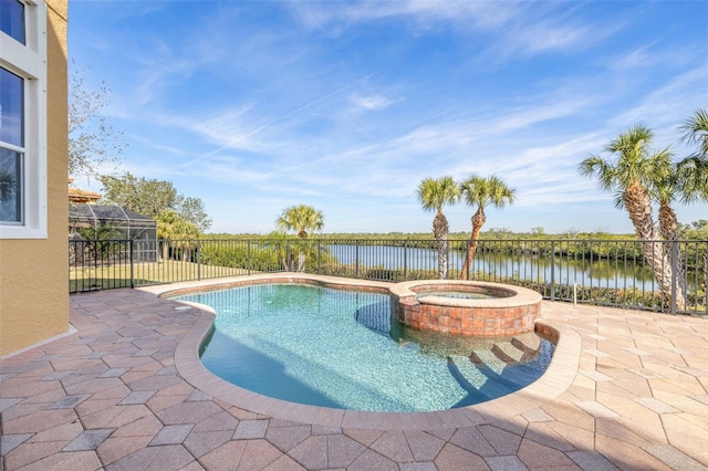 view of swimming pool with a patio area, an in ground hot tub, a water view, and glass enclosure