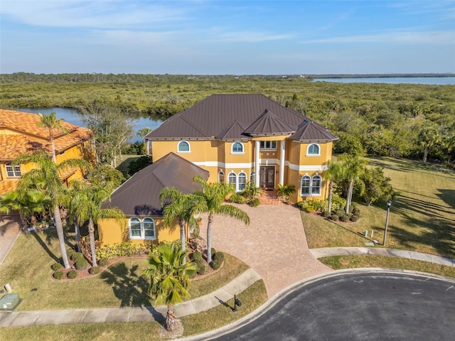 view of front of property with a water view and a front yard