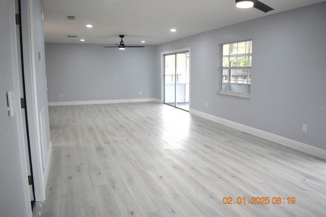 empty room with light hardwood / wood-style flooring and ceiling fan