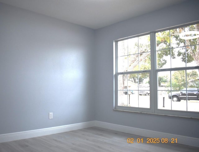 unfurnished room with hardwood / wood-style floors