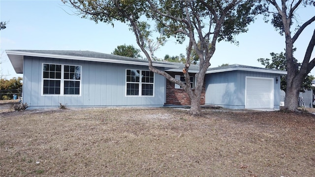 back of house with a garage