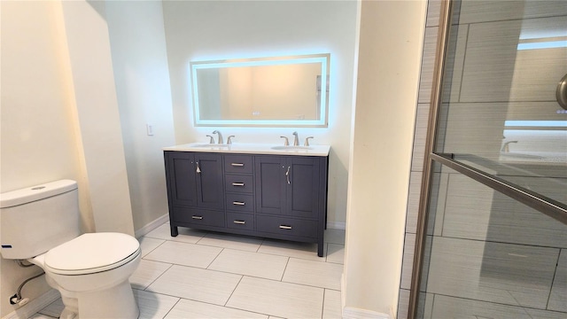 bathroom featuring vanity, tile patterned floors, and toilet