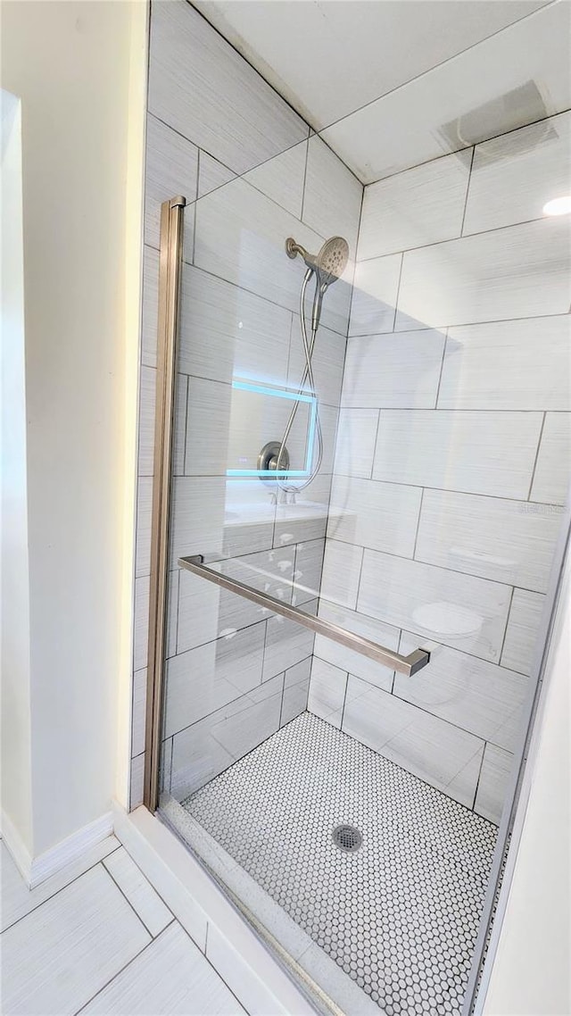 details with a shower with door