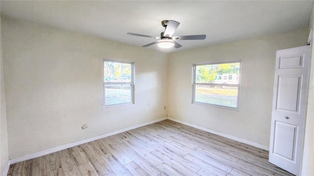 unfurnished room with ceiling fan and light hardwood / wood-style flooring