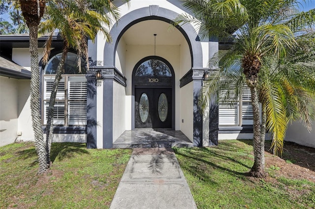 entrance to property with a yard