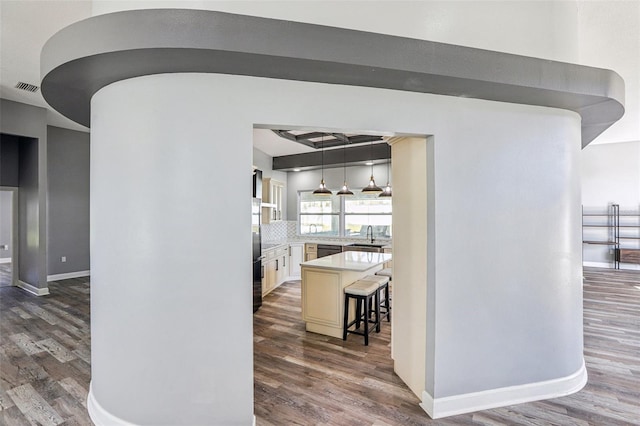 hallway with dark hardwood / wood-style floors and sink