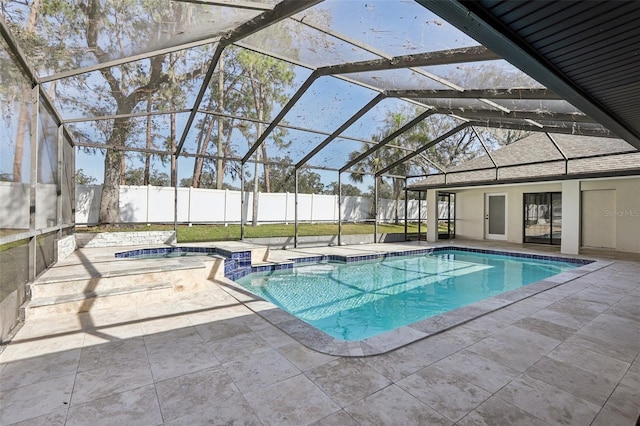 view of swimming pool featuring a patio and glass enclosure