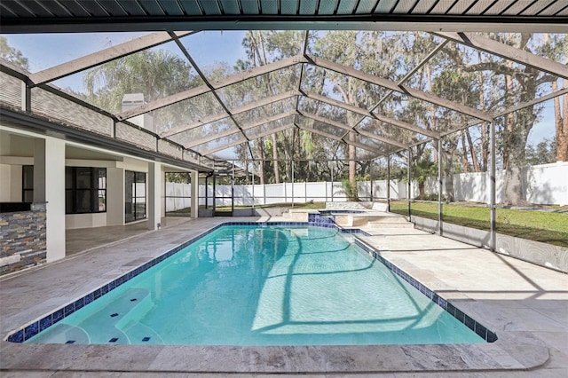 view of swimming pool with a lanai and a patio