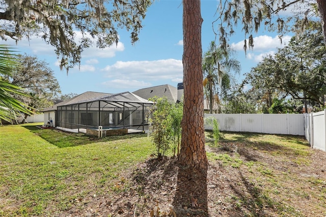 view of yard with glass enclosure