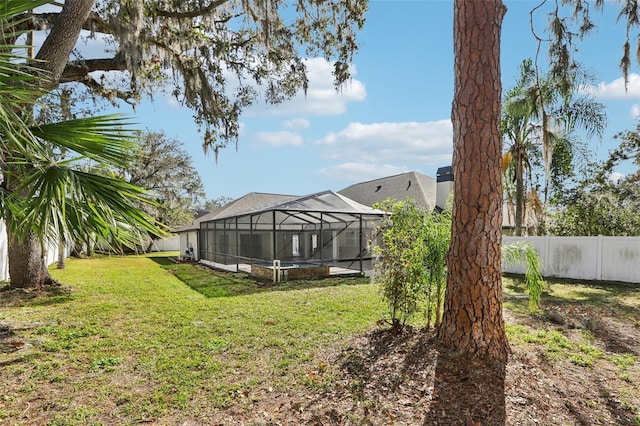 view of yard featuring glass enclosure