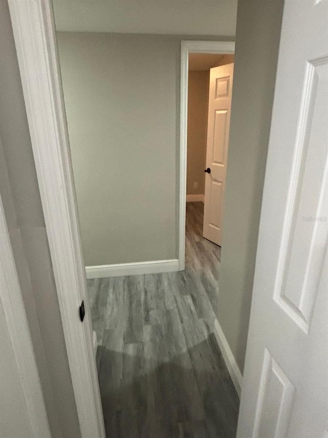 corridor featuring hardwood / wood-style floors