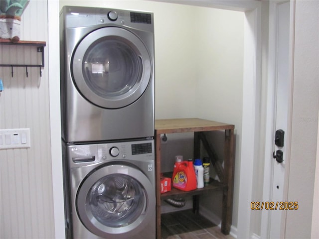 laundry area featuring stacked washer / dryer