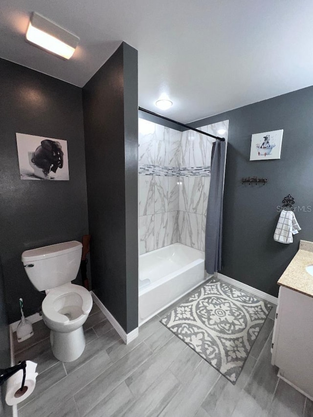 full bathroom featuring vanity, shower / tub combo with curtain, and toilet