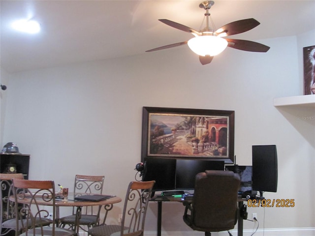 home office featuring lofted ceiling and ceiling fan