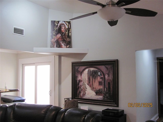 interior space featuring ornamental molding and ceiling fan