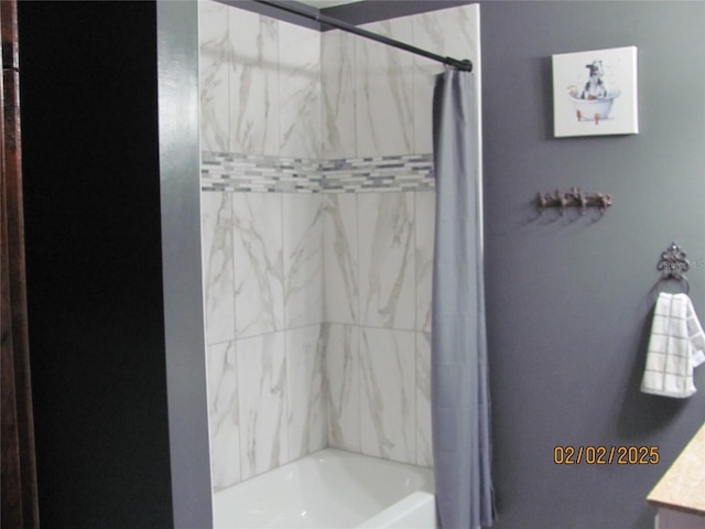 bathroom with shower / bath combination with curtain