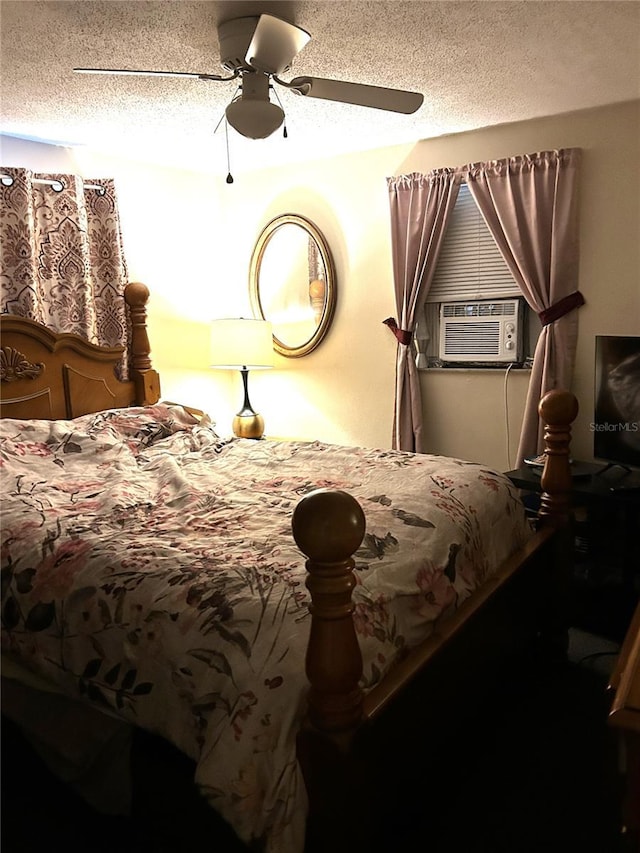 bedroom featuring a ceiling fan, cooling unit, and a textured ceiling