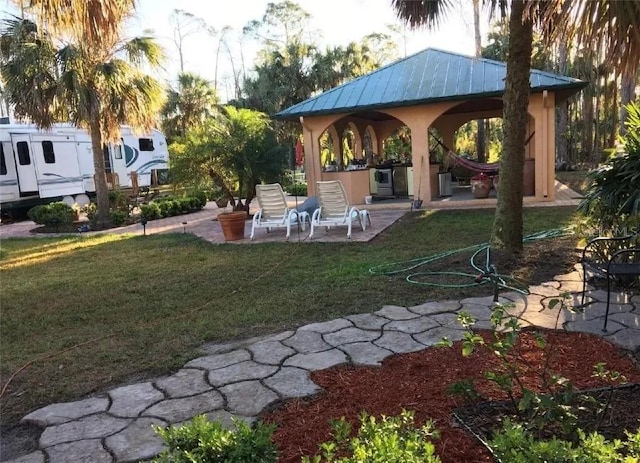 view of yard with a gazebo and a patio