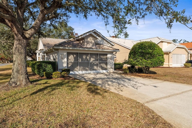 view of front facade with a garage and a front yard