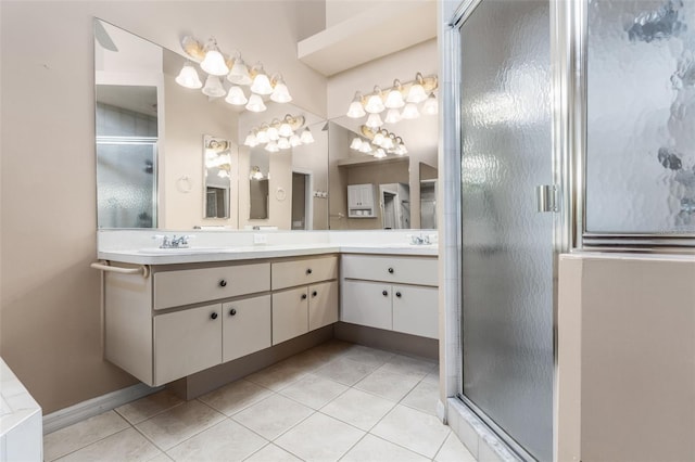 bathroom with tile patterned floors, a shower with shower door, and vanity