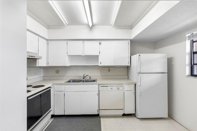 kitchen with sink, white appliances, white cabinets, and backsplash