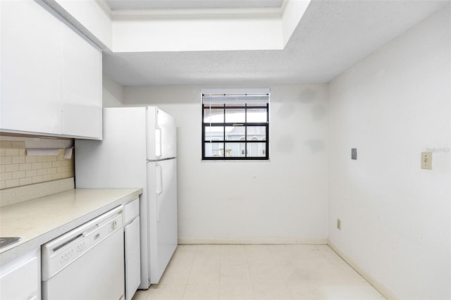 kitchen featuring white cabinetry, backsplash, white appliances, and a textured ceiling