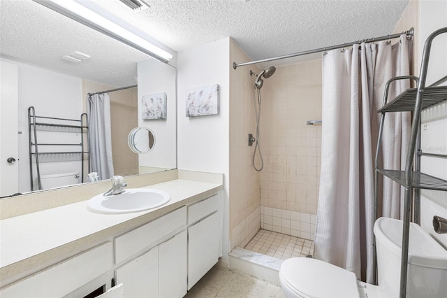 bathroom with vanity, a shower with curtain, toilet, and a textured ceiling