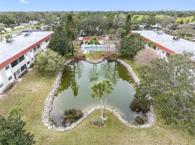 birds eye view of property with a water view