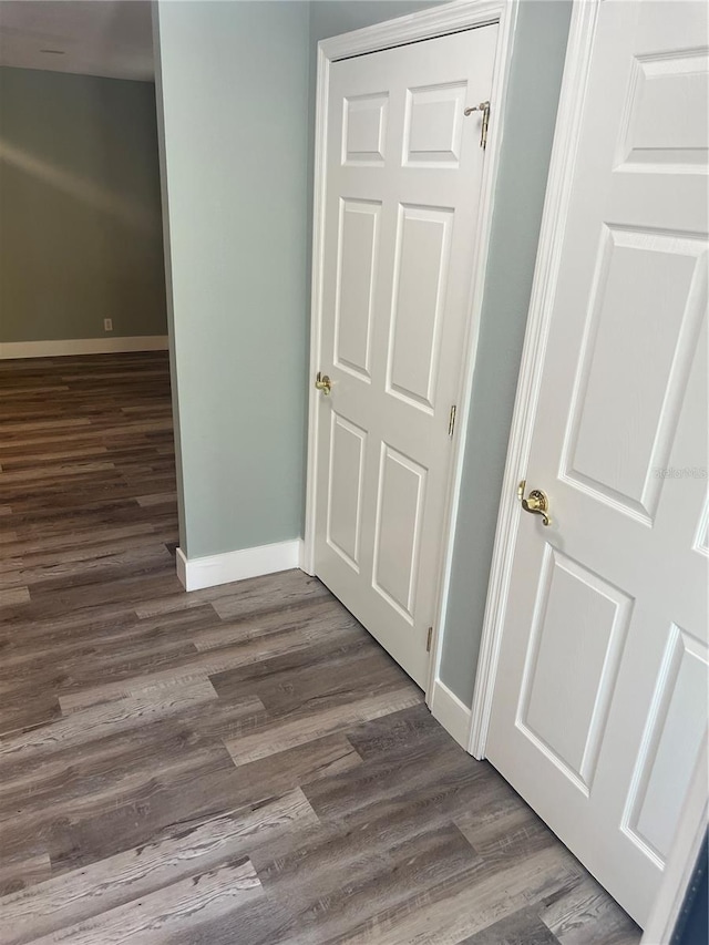 hall with dark wood-type flooring