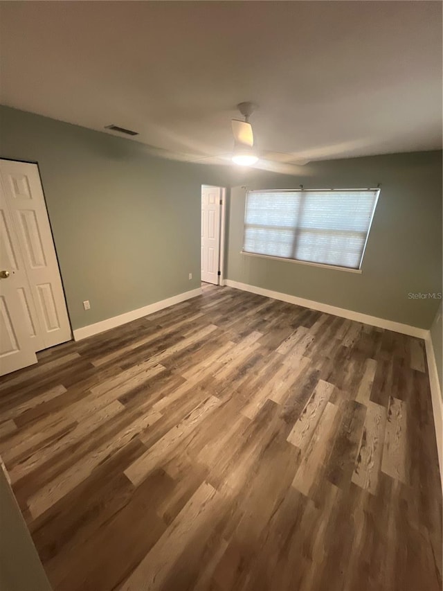 unfurnished room featuring dark hardwood / wood-style floors