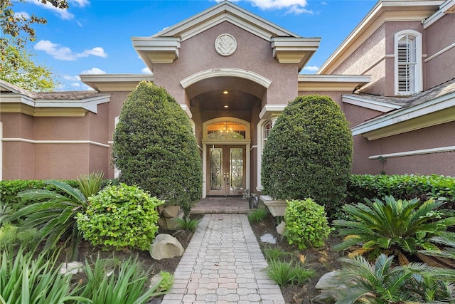 view of exterior entry featuring french doors