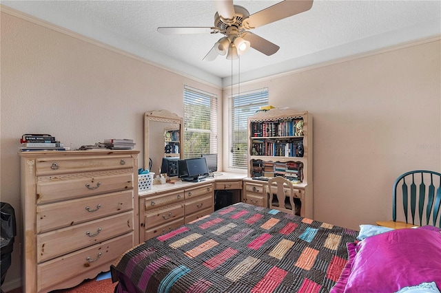 bedroom with crown molding, ceiling fan, and a textured ceiling