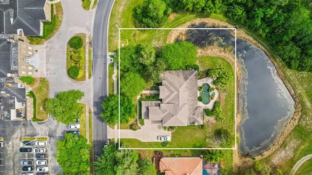 birds eye view of property featuring a water view