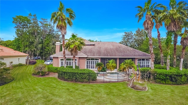 back of house featuring a yard