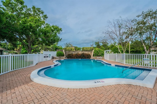 view of pool featuring a patio area