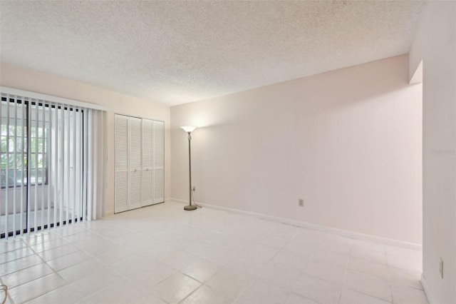 1601 43rd St N Unit 133, Saint Petersburg, FL 33713 - empty room featuring baseboards and a textured ceiling