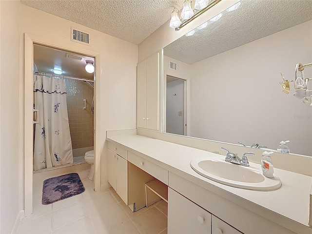 1601 43rd St N Unit 133, Saint Petersburg, FL 33713 - full bathroom with vanity, visible vents, tile patterned flooring, a textured ceiling, and toilet