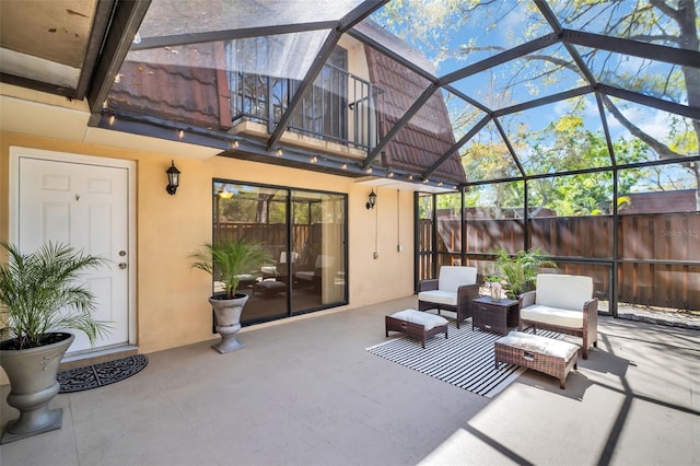 2730 5th Ct, Palm Harbor, FL 34684 - view of patio with glass enclosure, outdoor lounge area, and fence