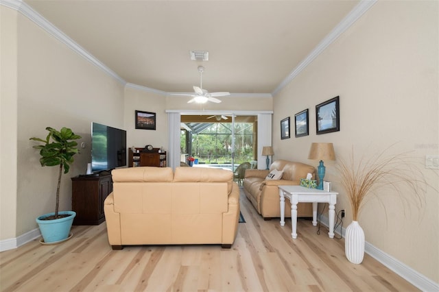 living room featuring ceiling fan, ornamental molding, and light hardwood / wood-style floors