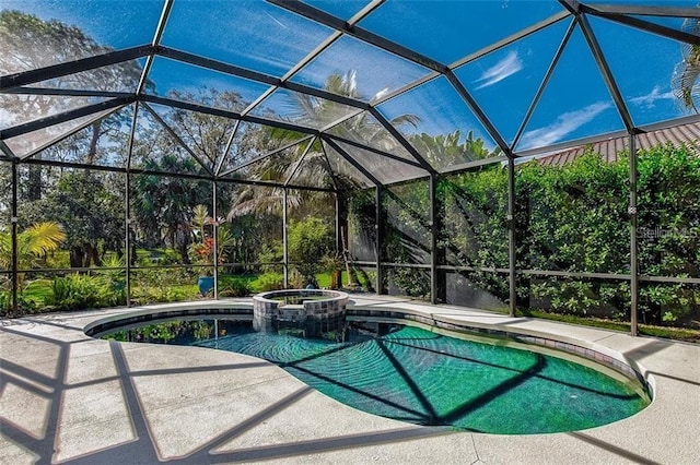 view of pool with an in ground hot tub, a lanai, and a patio