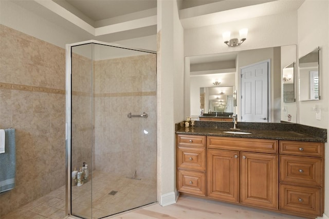 bathroom with vanity and walk in shower