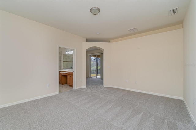 empty room featuring light colored carpet