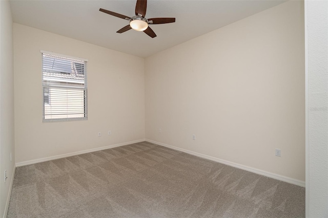 empty room featuring ceiling fan and carpet flooring