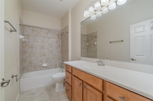 full bathroom with tiled shower / bath, vanity, toilet, and tile patterned flooring