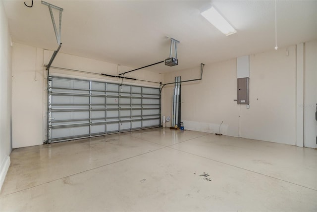 garage featuring a garage door opener and electric panel