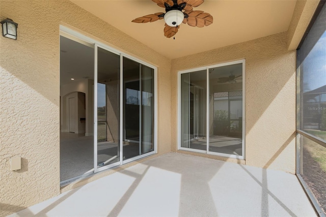 exterior space featuring ceiling fan