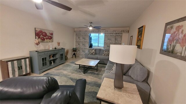 5880 38th Ave N Unit 204, Saint Petersburg, FL 33710 - living room featuring ceiling fan and a textured ceiling